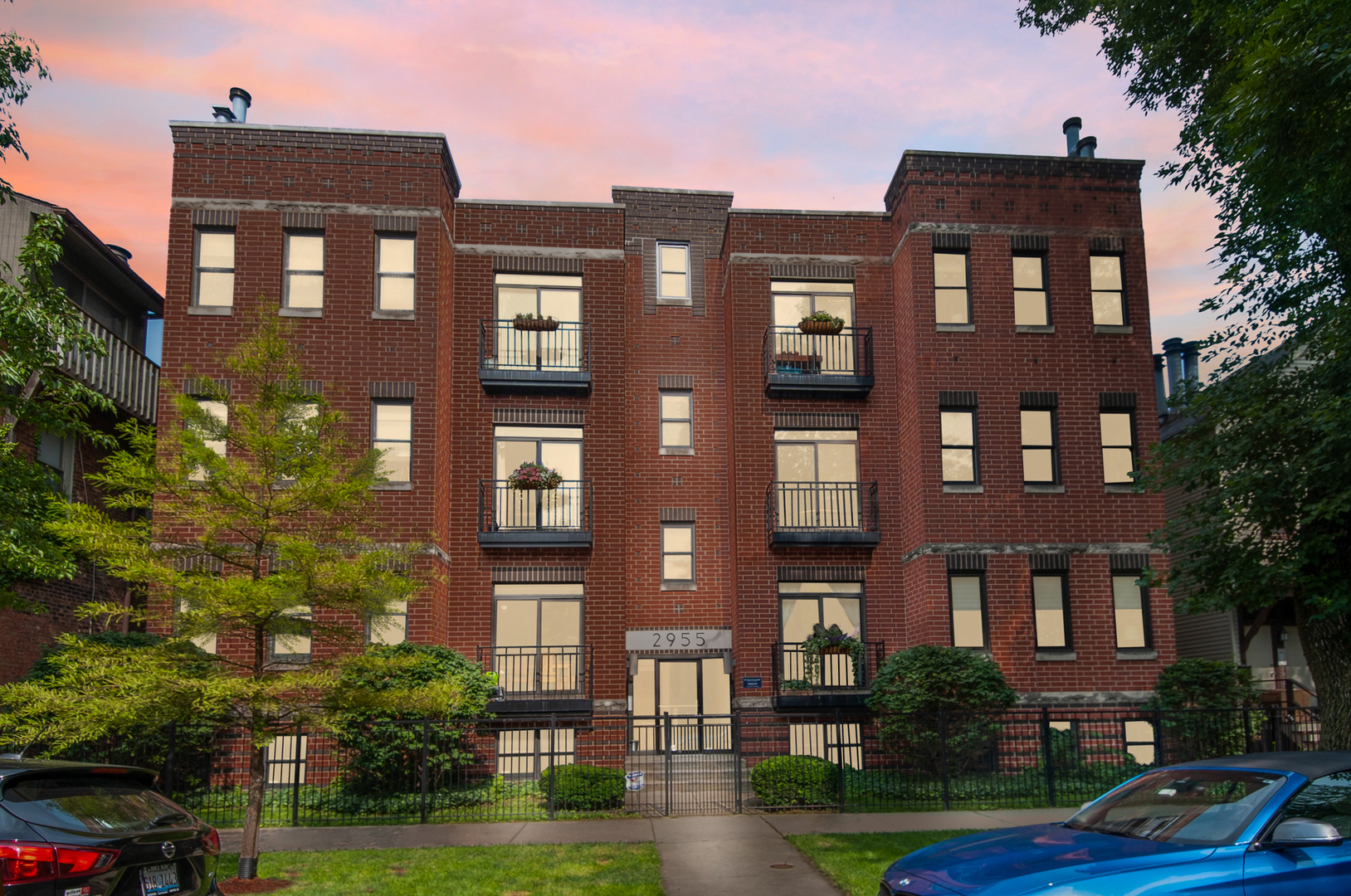 2955 North Racine Avenue, Unit 1A Chicago, IL 60657 - Photo 1 of 29 a front view of a building with garden
