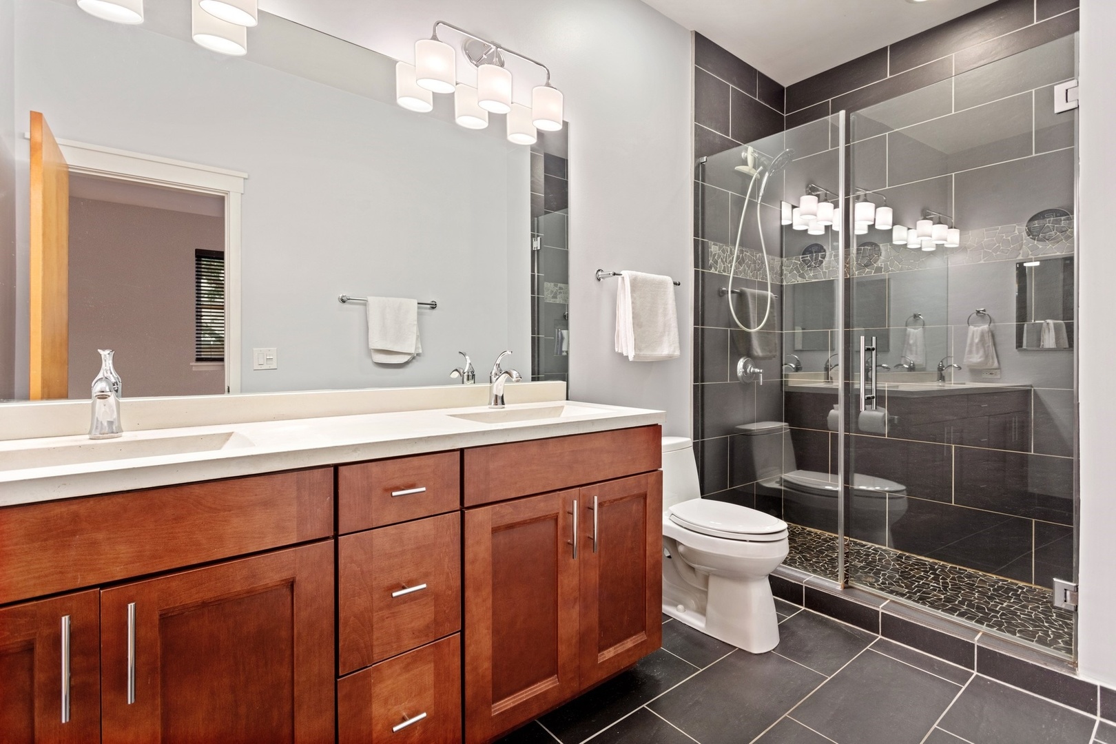 2955 North Racine Avenue, Unit 1A Chicago, IL 60657 - Photo 11 of 29 a bathroom with a toilet sink and shower