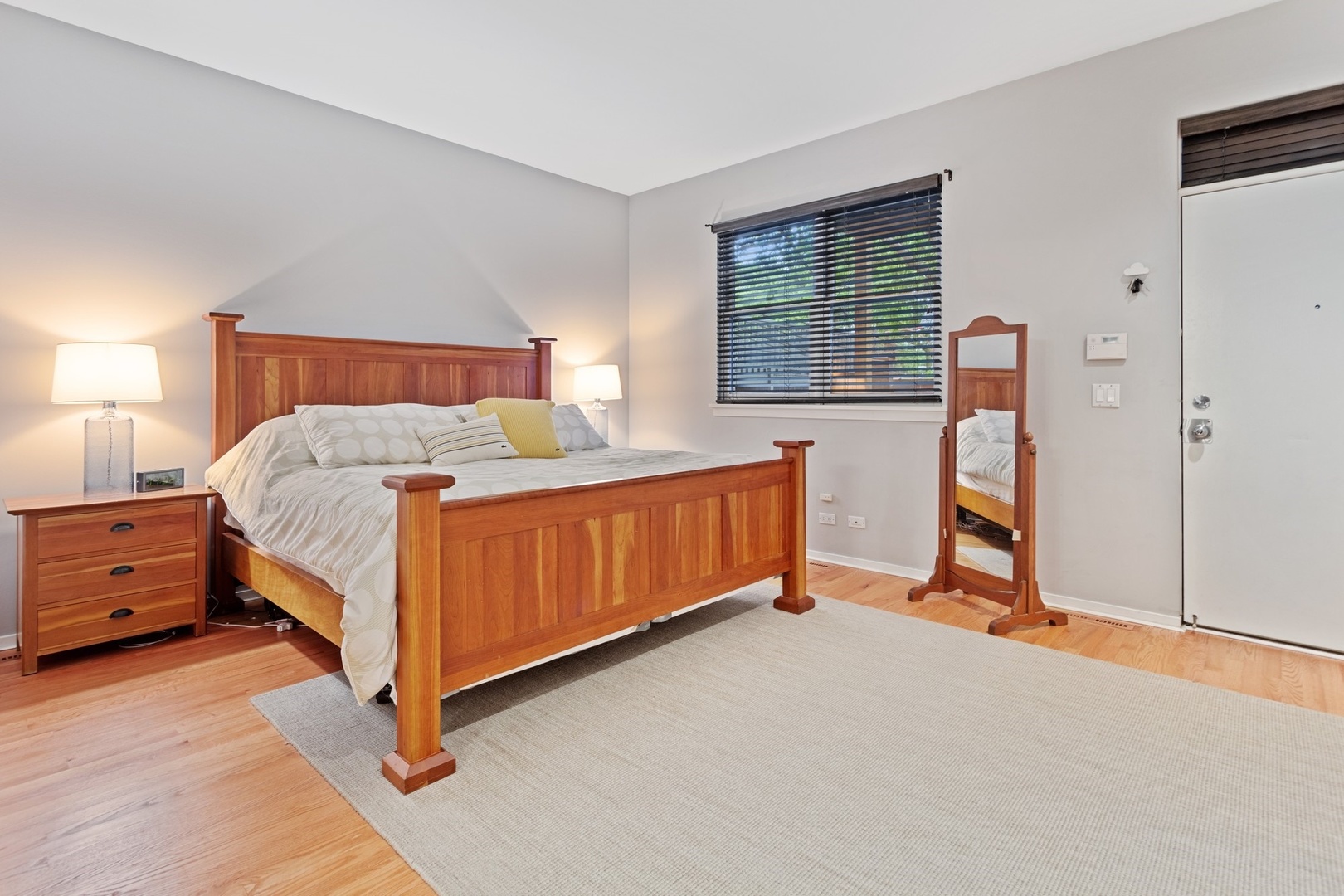 2955 North Racine Avenue, Unit 1A Chicago, IL 60657 - Photo 12 of 29 a bedroom with a bed and a dresser next to a window