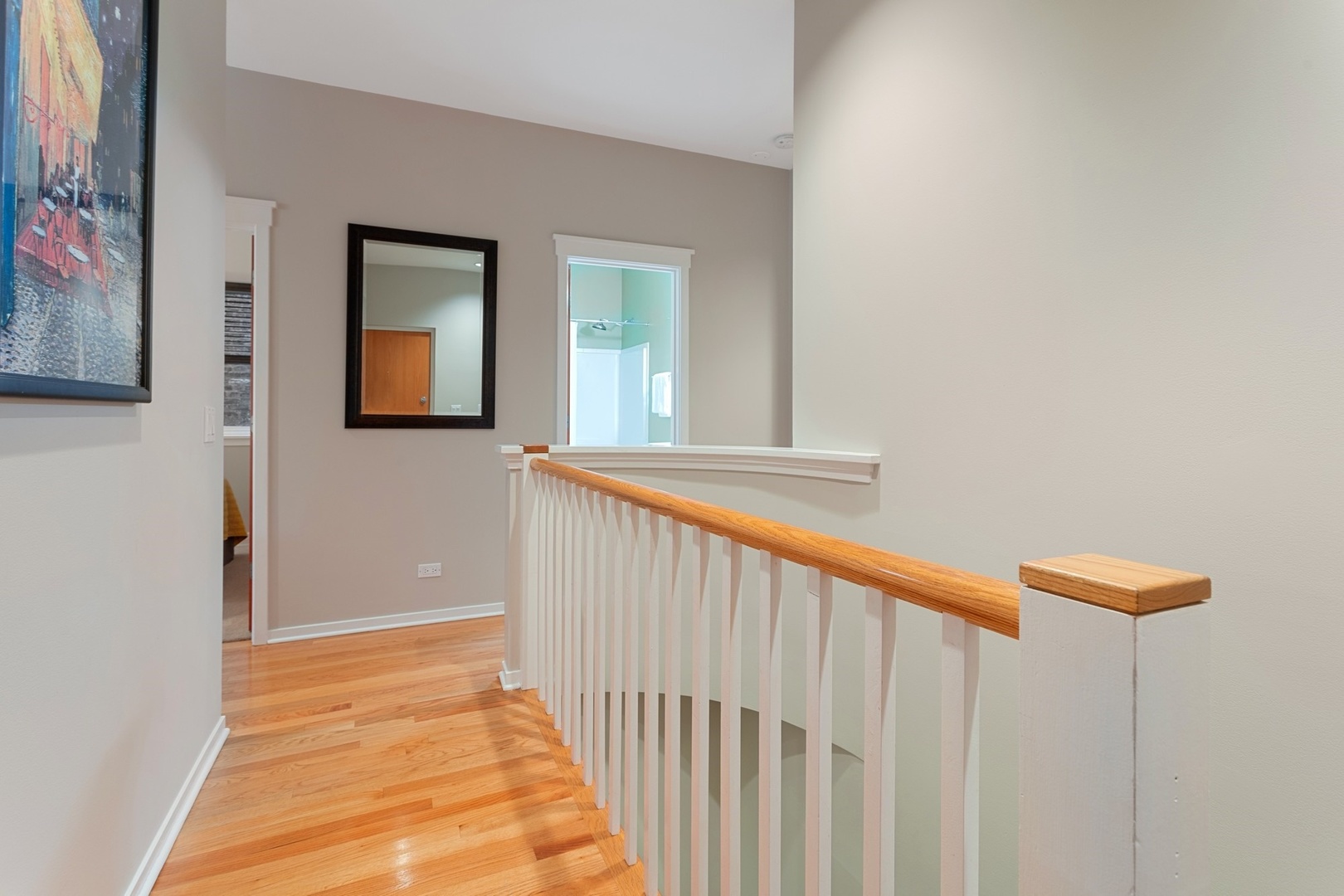 2955 North Racine Avenue, Unit 1A Chicago, IL 60657 - Photo 15 of 29 a view of a hallway with wooden floor and a bathroom