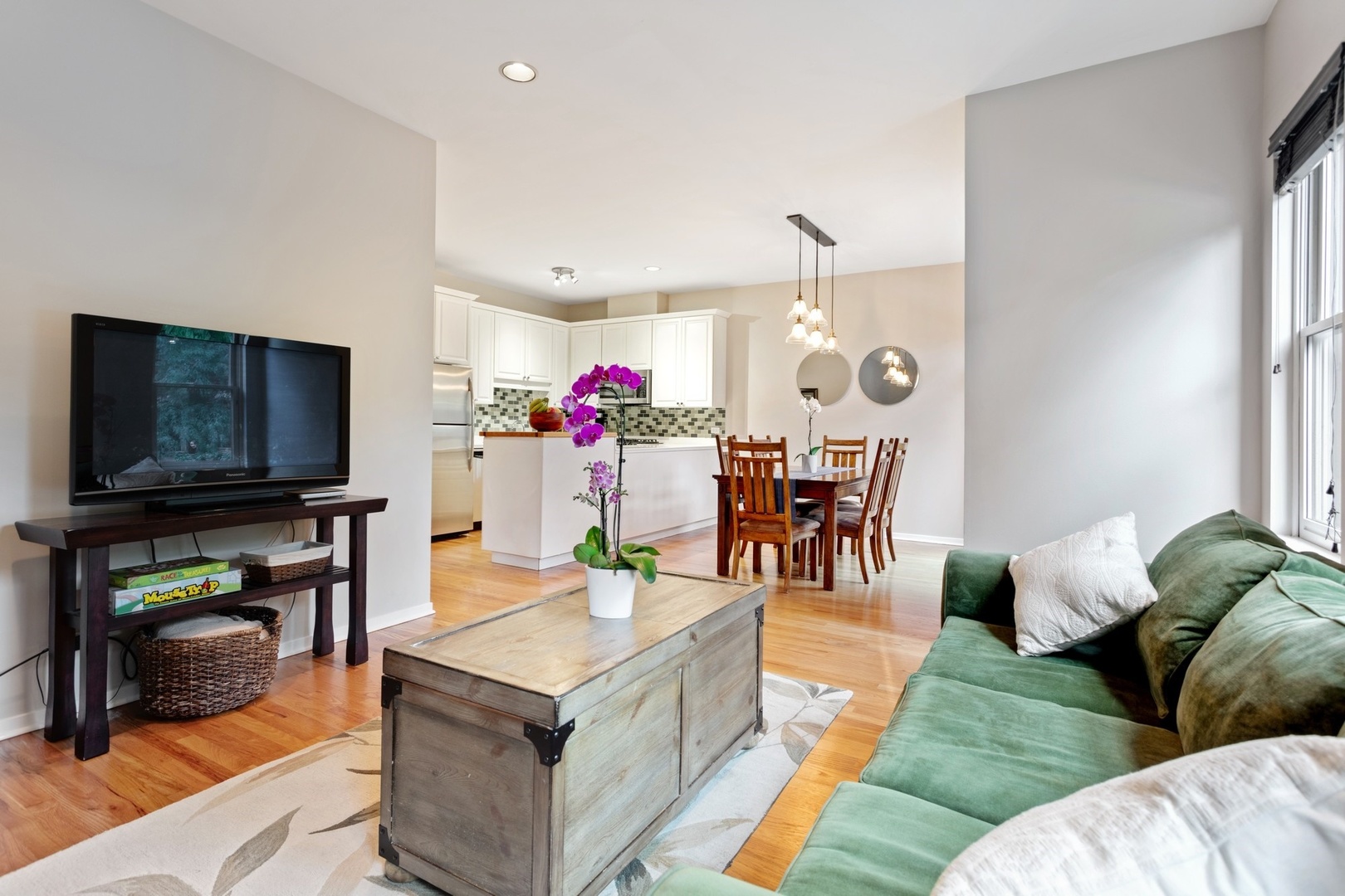 2955 North Racine Avenue, Unit 1A Chicago, IL 60657 - Photo 6 of 29 a living room with furniture and a flat screen tv