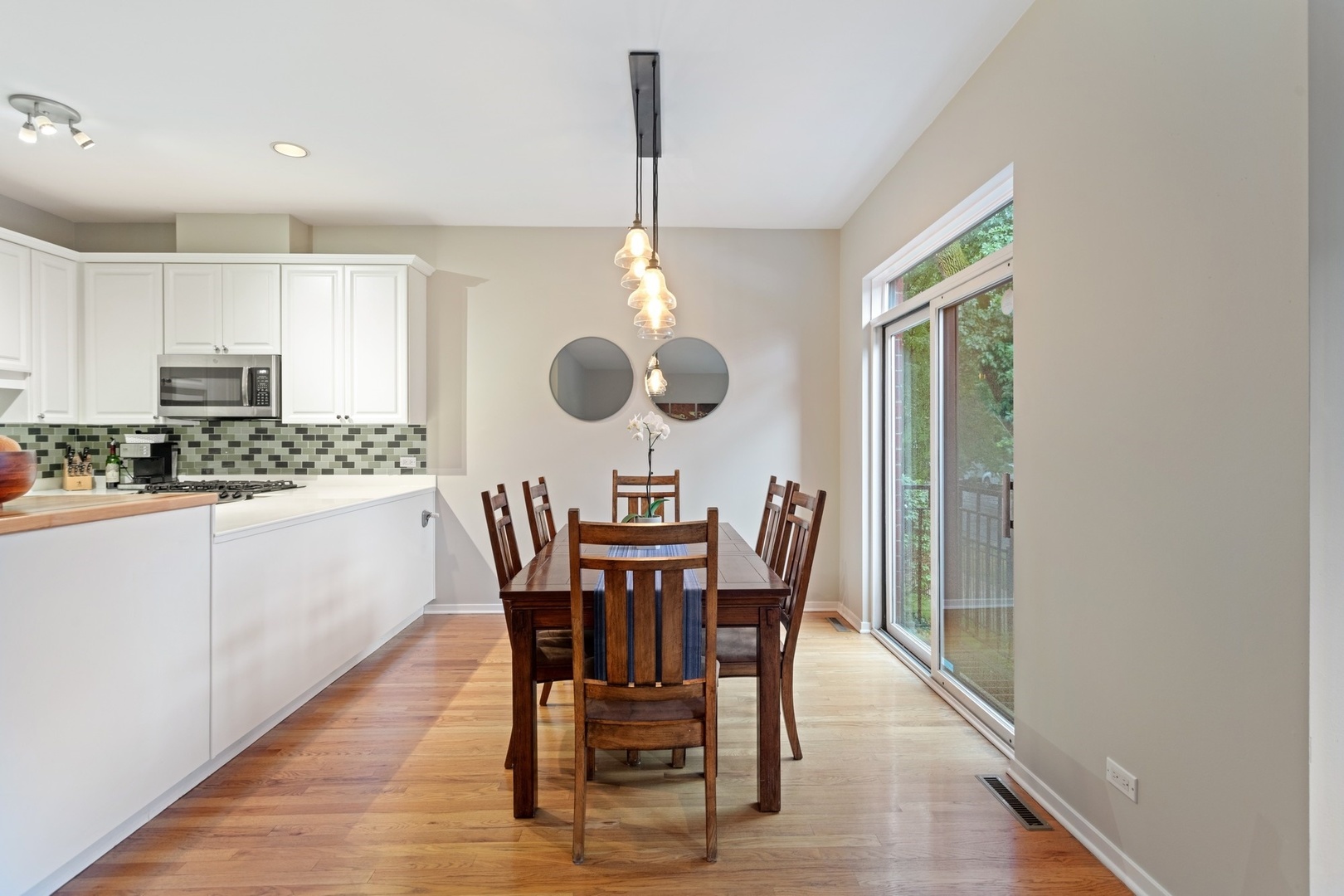 2955 North Racine Avenue, Unit 1A Chicago, IL 60657 - Photo 7 of 29 a view of a dining room with furniture and chandelier