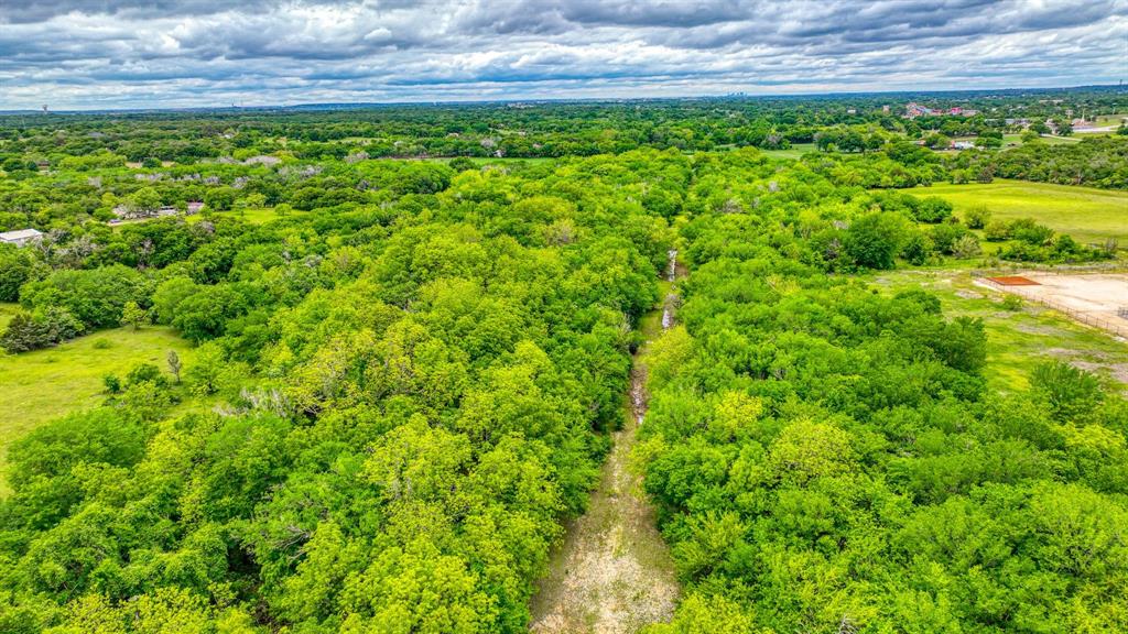 1201 South Briaroaks Road Burleson, TX 76028 - Photo 23 of 40 a view of a yard with an outdoor space