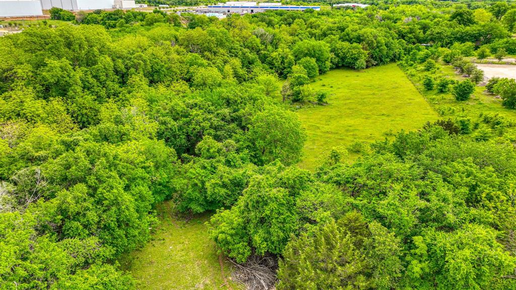 1201 South Briaroaks Road Burleson, TX 76028 - Photo 26 of 40 a view of a big yard with plants and large trees