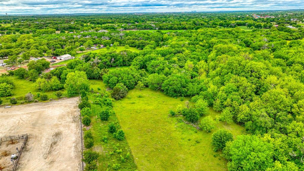 1201 South Briaroaks Road Burleson, TX 76028 - Photo 27 of 40 a view of a garden with an empty space