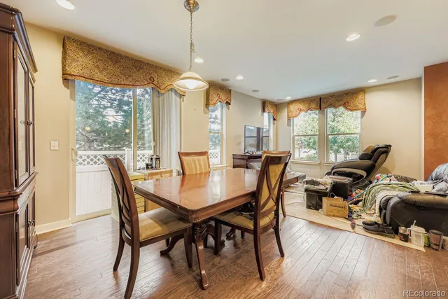 a view of a dining room with furniture window and wooden floor