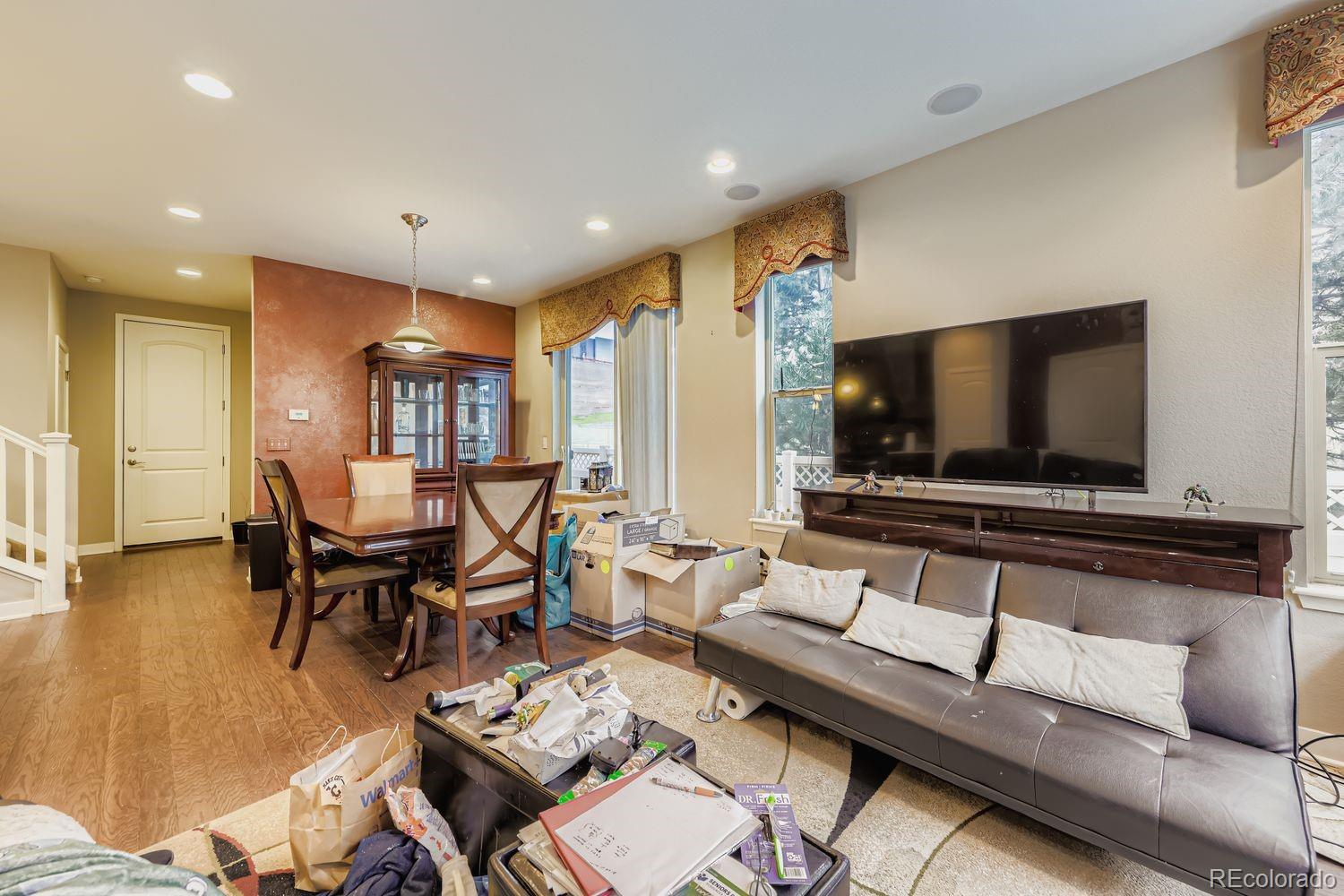 8508 Redpoint Way Broomfield, CO 80021 - Photo 4 of 21 a living room with furniture and a flat screen tv