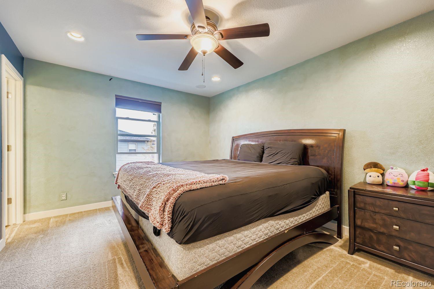 8508 Redpoint Way Broomfield, CO 80021 - Photo 8 of 21 a bedroom with a bed and window