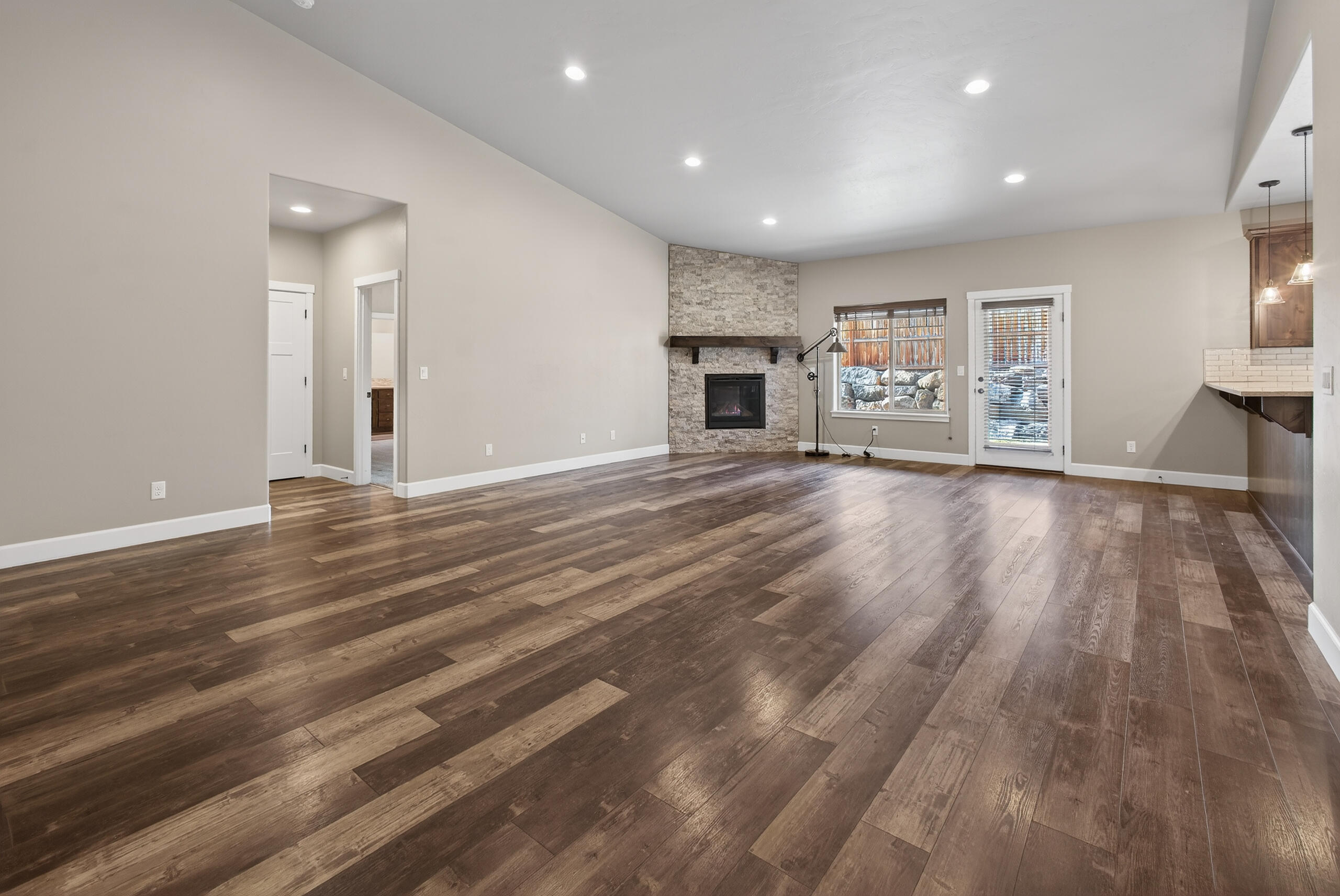 2793 Southwest 33rd Street Redmond, OR 97756 - Photo 8 of 44 a view of empty room with wooden floor and fireplace