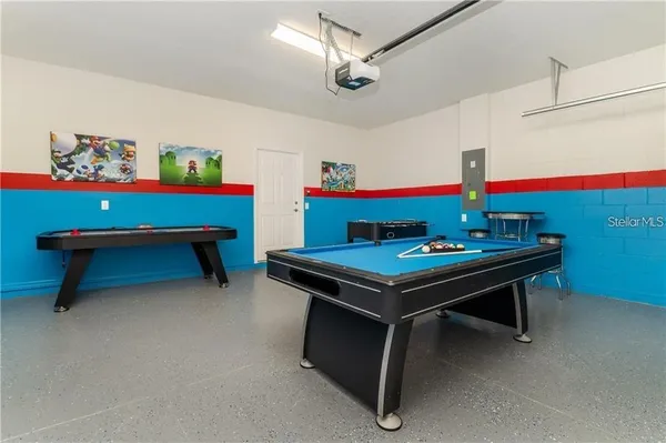 a room with furniture and pool table
