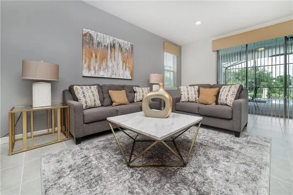 a living room with furniture and a rug
