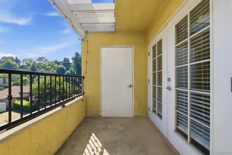 a view of balcony with furniture