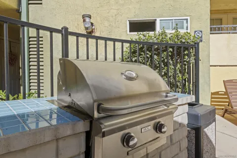 a view of a fireplace and table in a patio