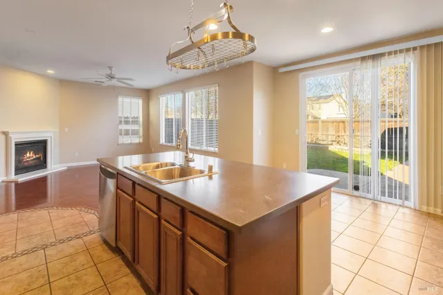 a kitchen with a sink a counter top space and appliances