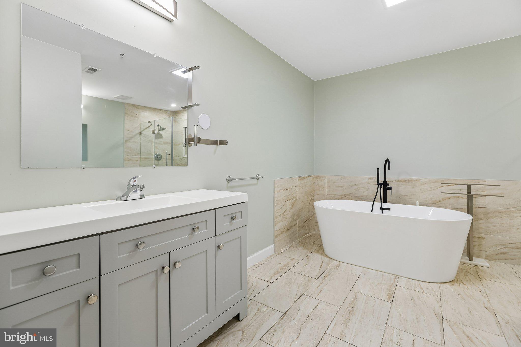 624 Brickhouse Road Princeton, NJ 08540 - Photo 33 of 43 a bathroom with a sink a toilet and mirror