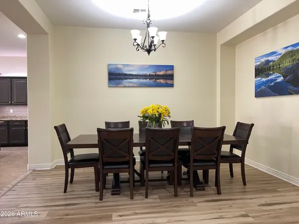 a living room with furniture and a ceiling fan