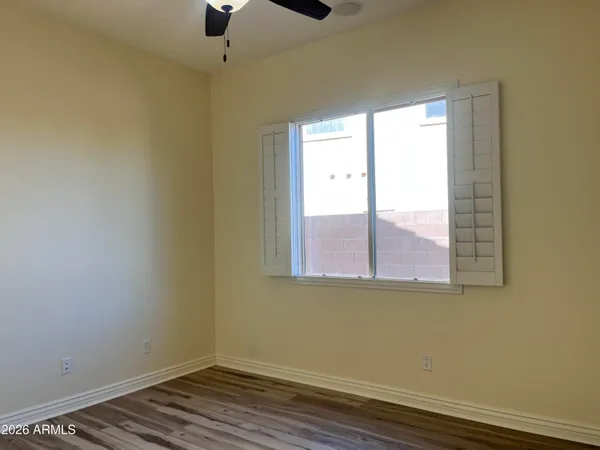 a view of a hallway with wooden shelves