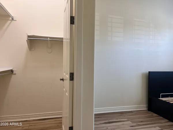 a room with a bed and a chandelier