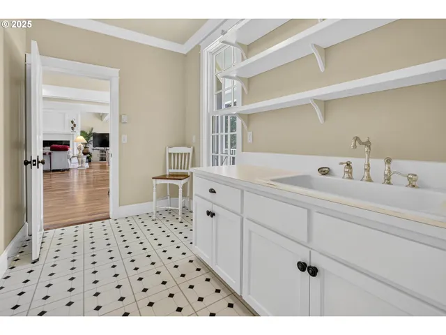 a bathroom with a sink a mirror and shower