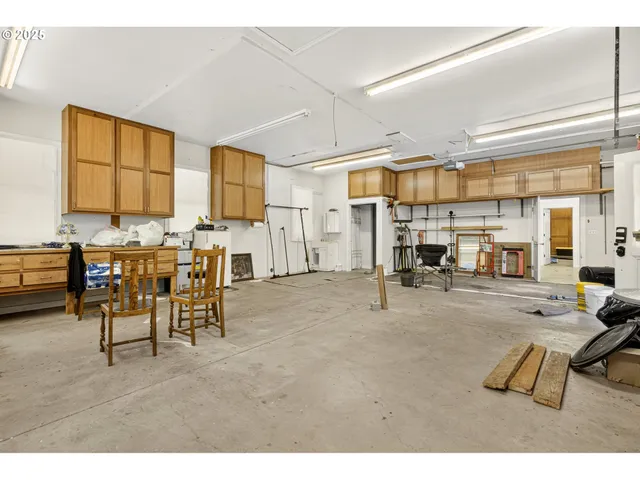 a living room with lots of furniture and a large window