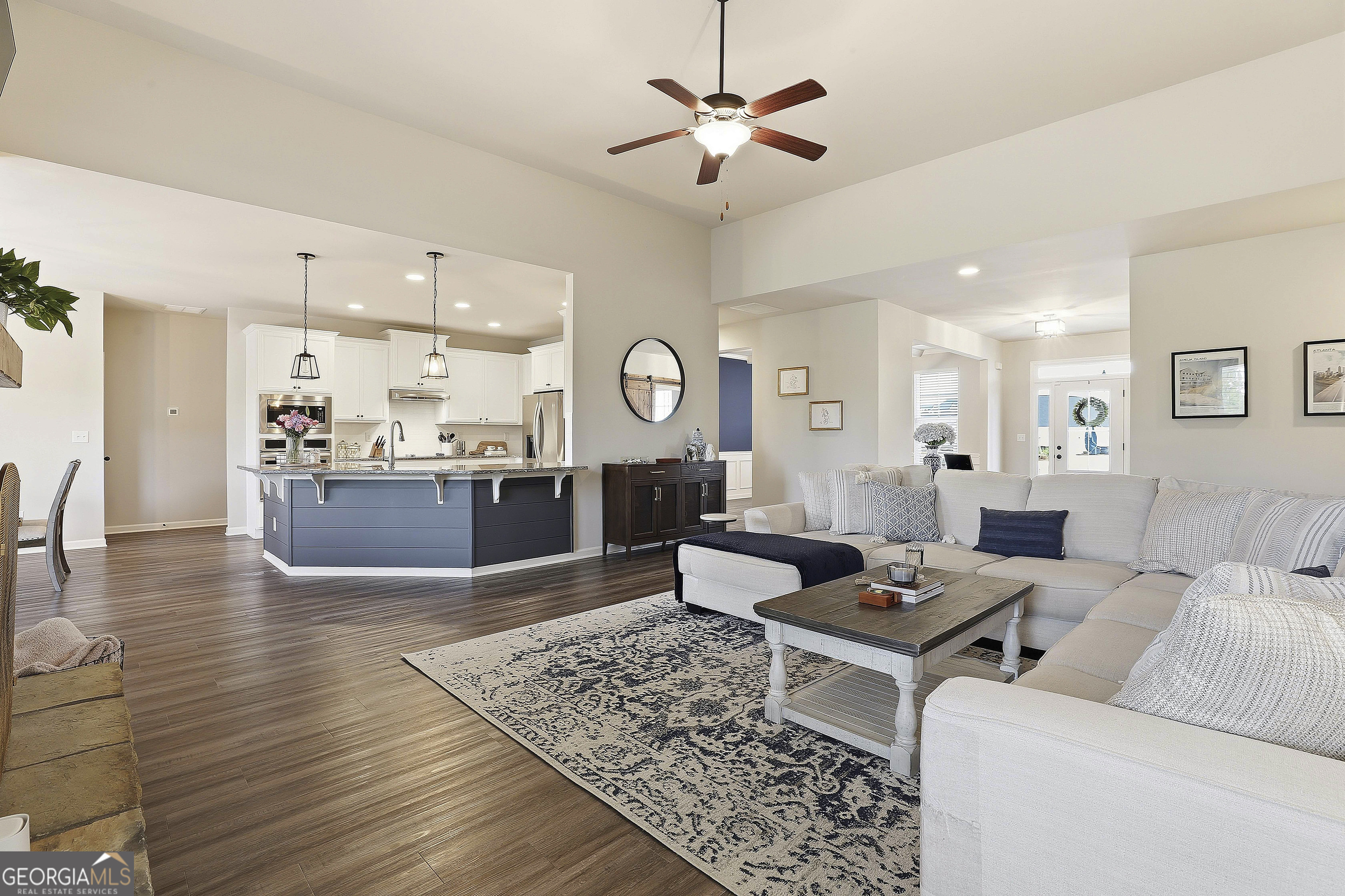 66 Chapman Farm Road Senoia, GA 30276 - Photo 15 of 46 a living room with furniture kitchen view and a table