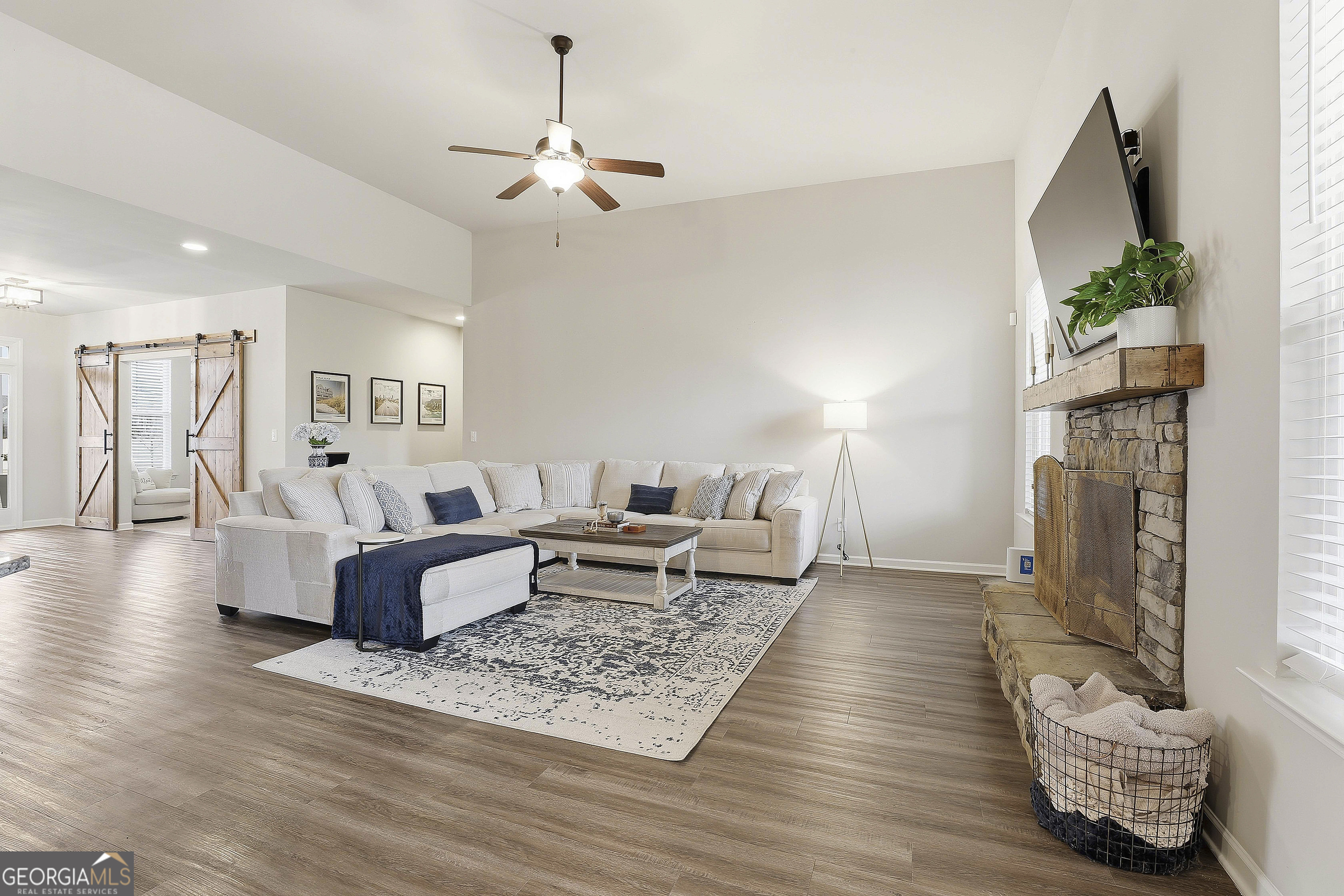 66 Chapman Farm Road Senoia, GA 30276 - Photo 17 of 46 a living room with furniture and a fireplace