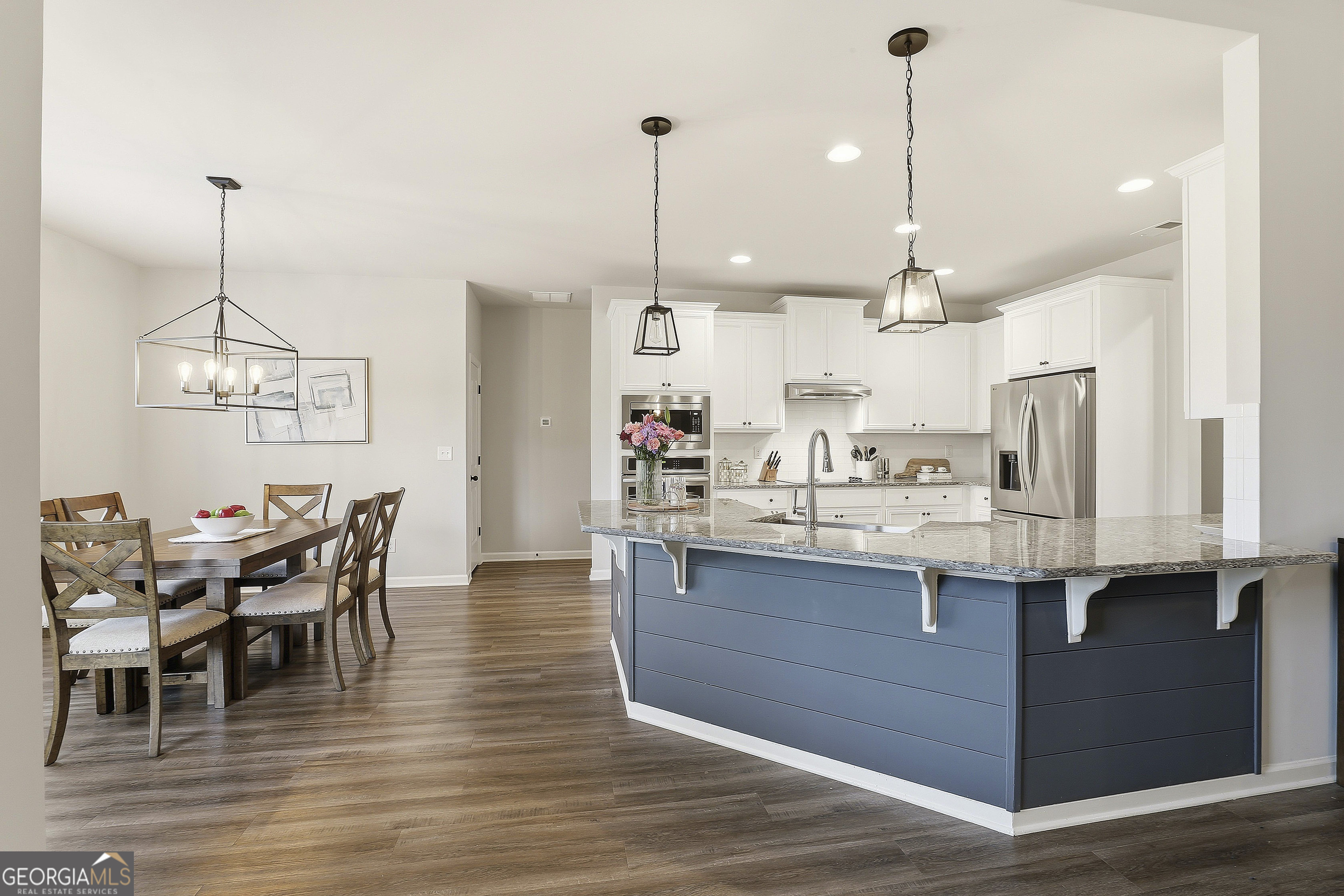 66 Chapman Farm Road Senoia, GA 30276 - Photo 18 of 46 a view of a kitchen counter space and wooden floor