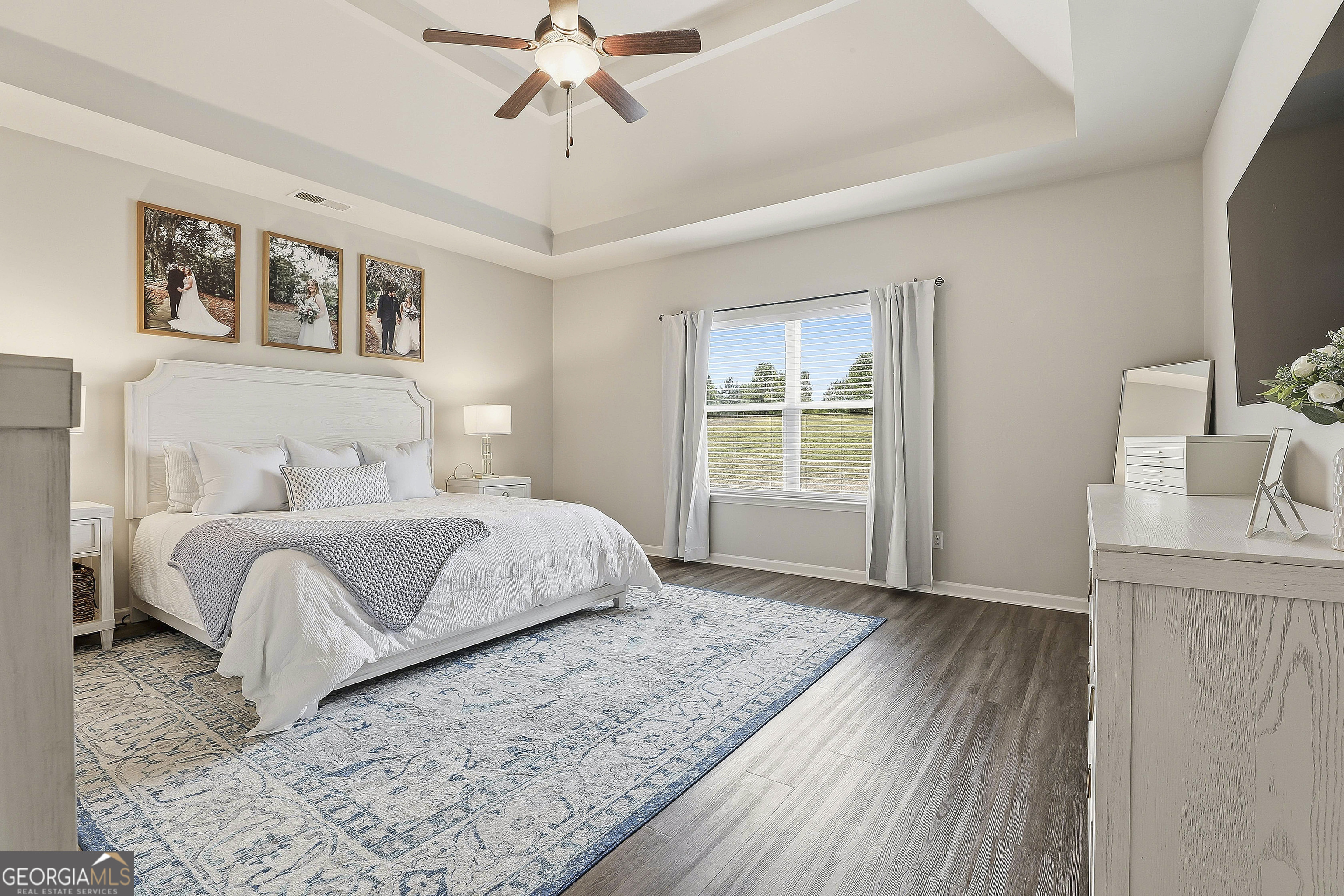 66 Chapman Farm Road Senoia, GA 30276 - Photo 24 of 46 a bedroom with a large bed and a window