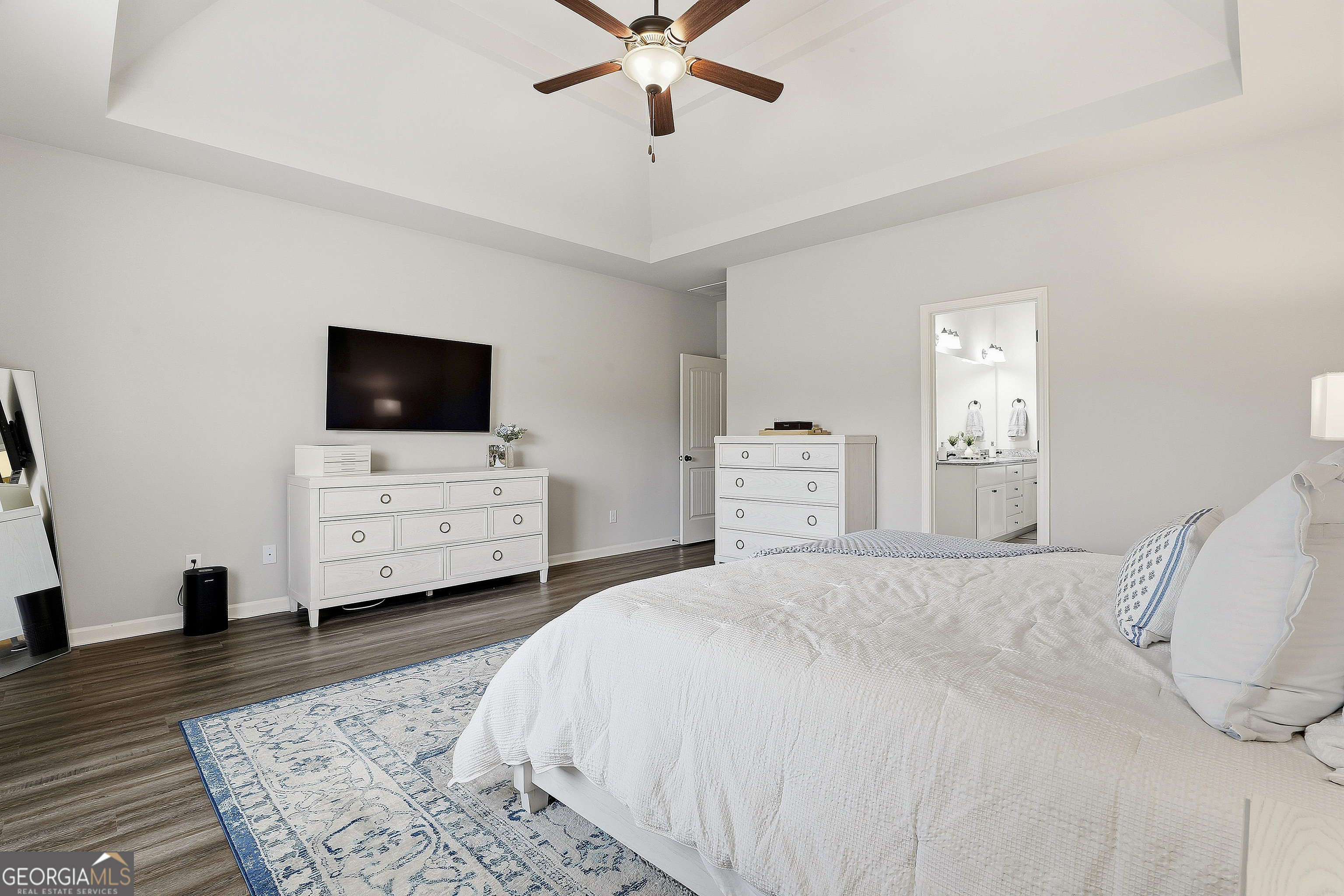 66 Chapman Farm Road Senoia, GA 30276 - Photo 25 of 46 a bedroom with a bed window and a flat screen tv