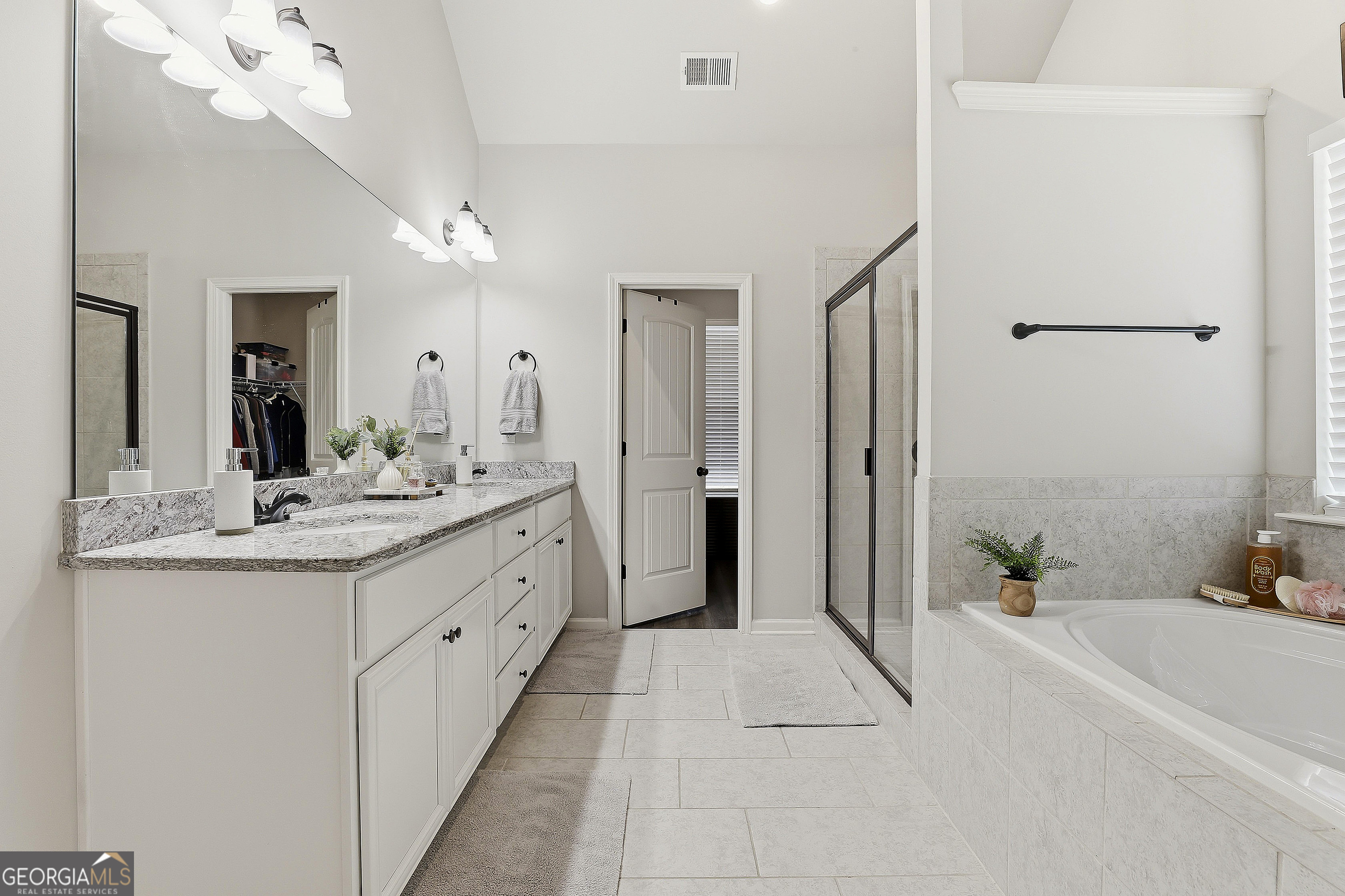 66 Chapman Farm Road Senoia, GA 30276 - Photo 26 of 46 a spacious bathroom with a double vanity sink mirror and shower