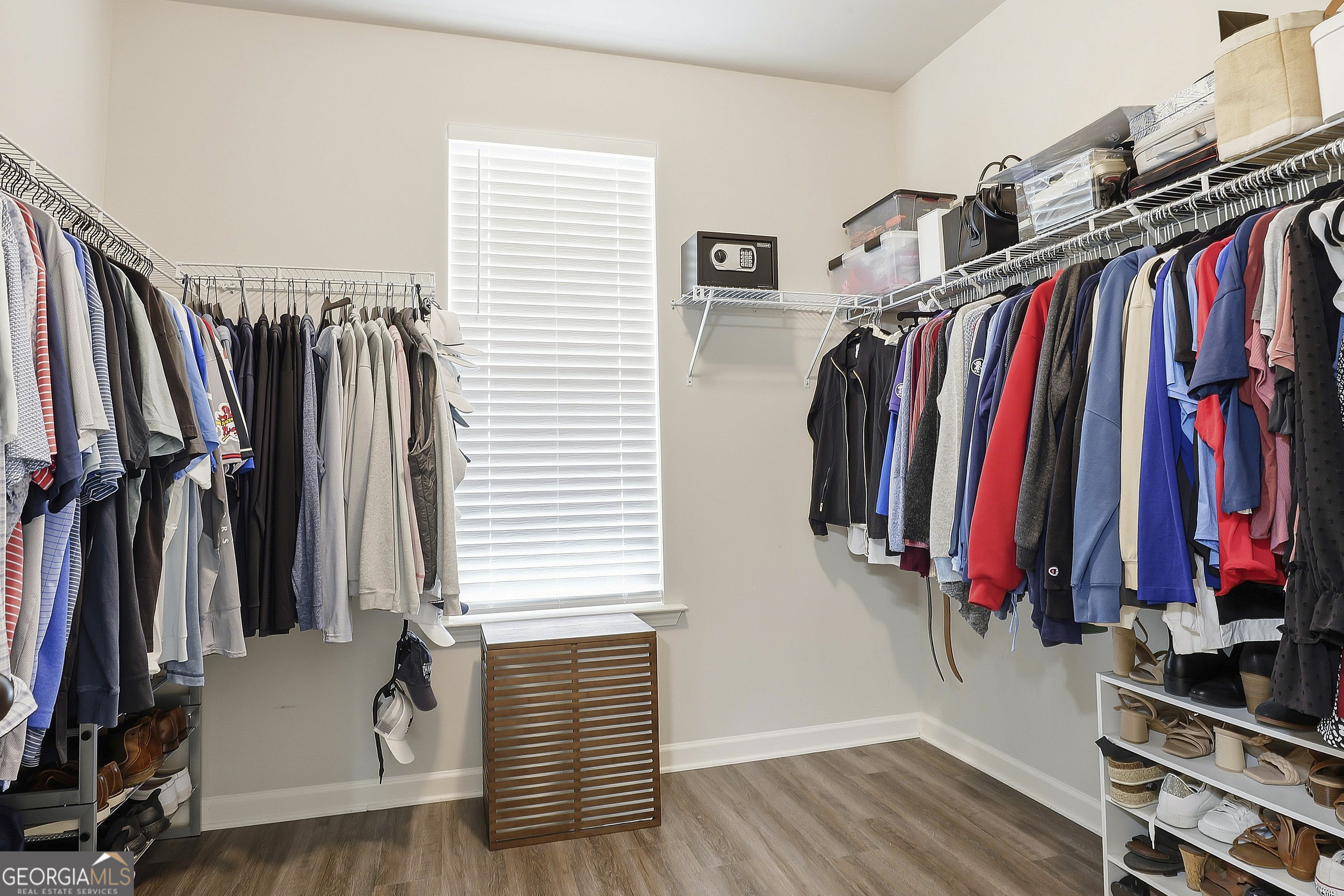 66 Chapman Farm Road Senoia, GA 30276 - Photo 28 of 46 a view of walk in closet with clothes and shoes