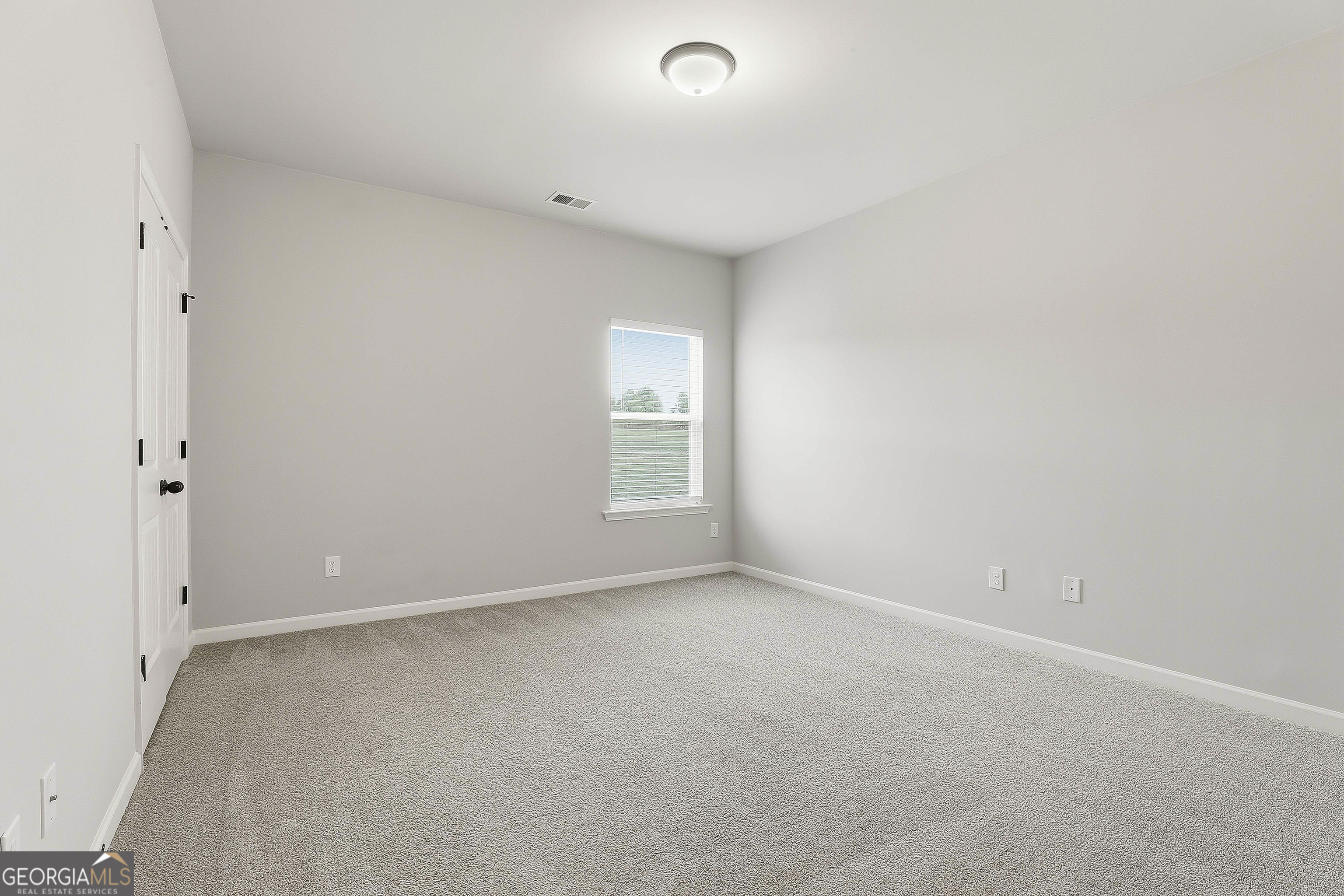 66 Chapman Farm Road Senoia, GA 30276 - Photo 29 of 46 a view of an empty room with a window