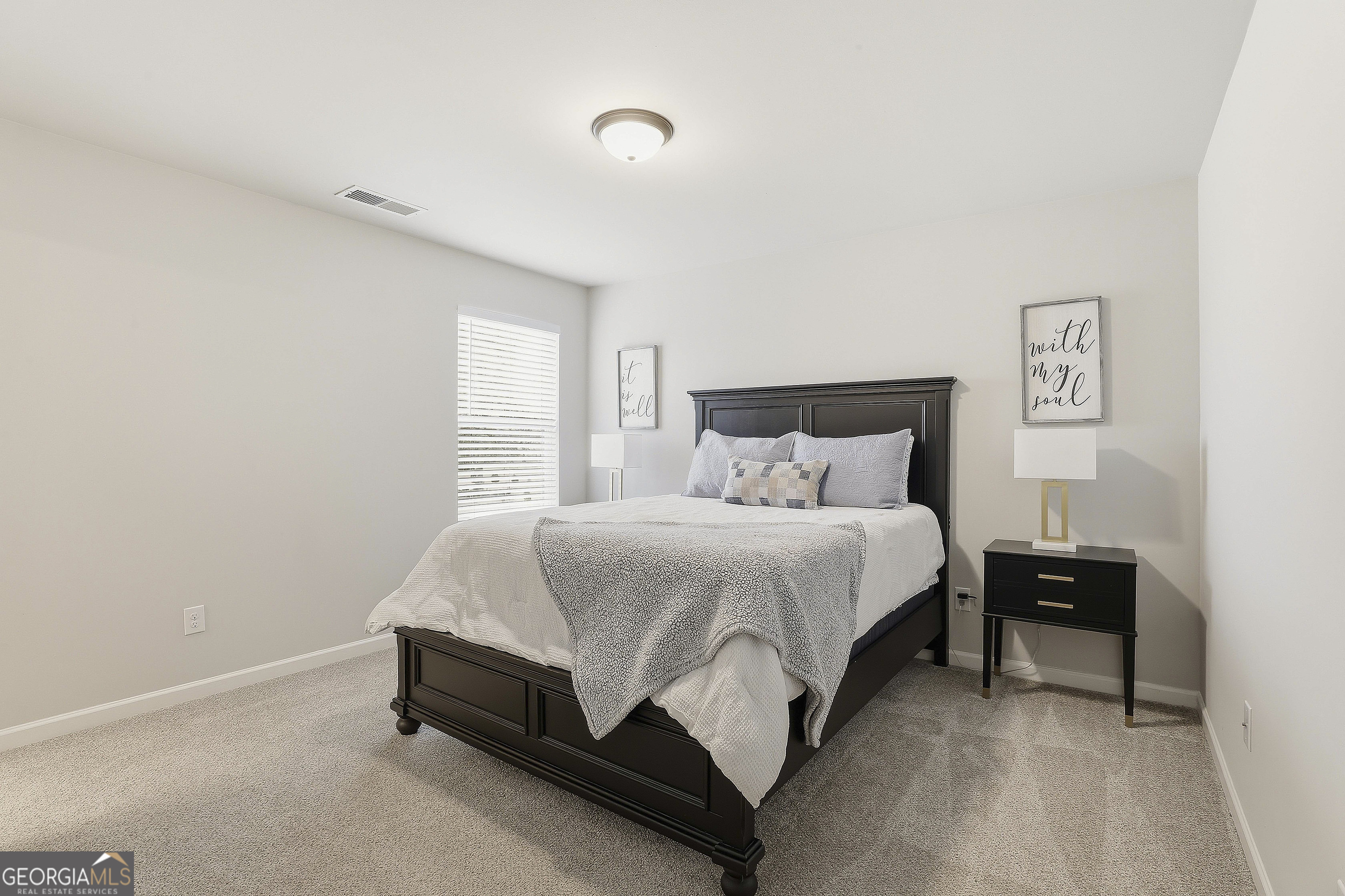 66 Chapman Farm Road Senoia, GA 30276 - Photo 35 of 46 a bedroom with a bed and window