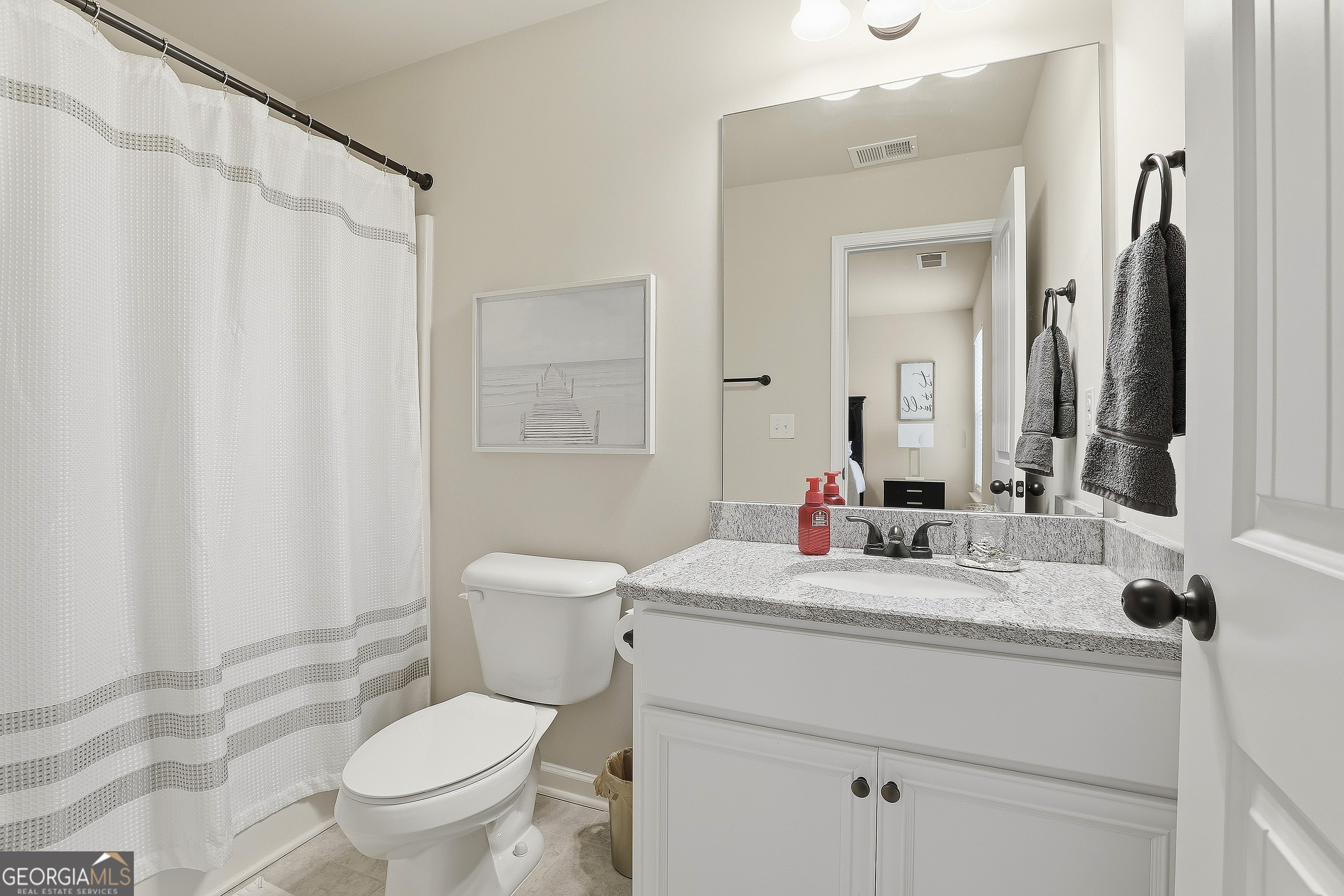 66 Chapman Farm Road Senoia, GA 30276 - Photo 36 of 46 a bathroom with a sink toilet vanity and shower