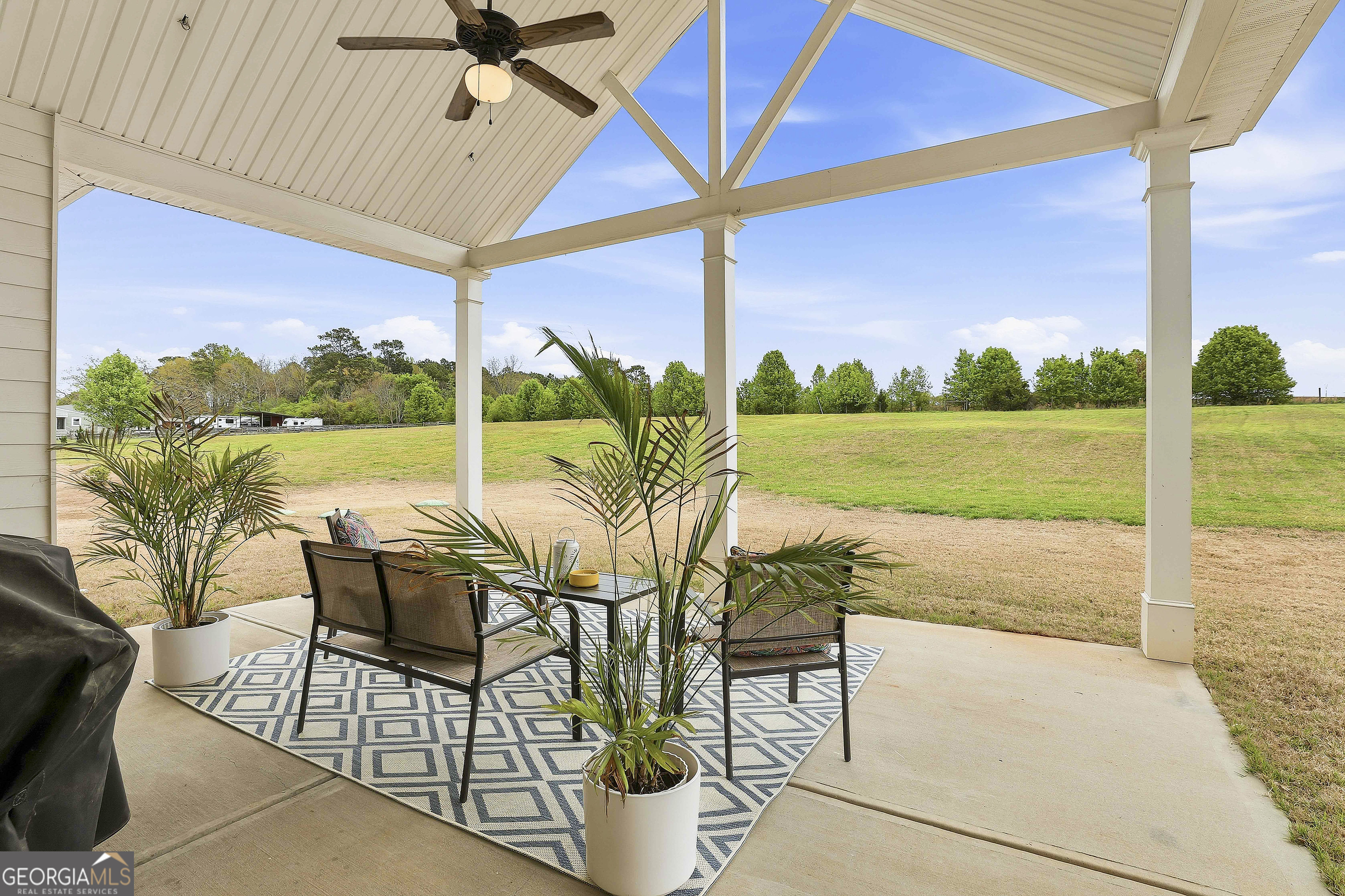 66 Chapman Farm Road Senoia, GA 30276 - Photo 37 of 46 a view of a patio with a table chairs and a table
