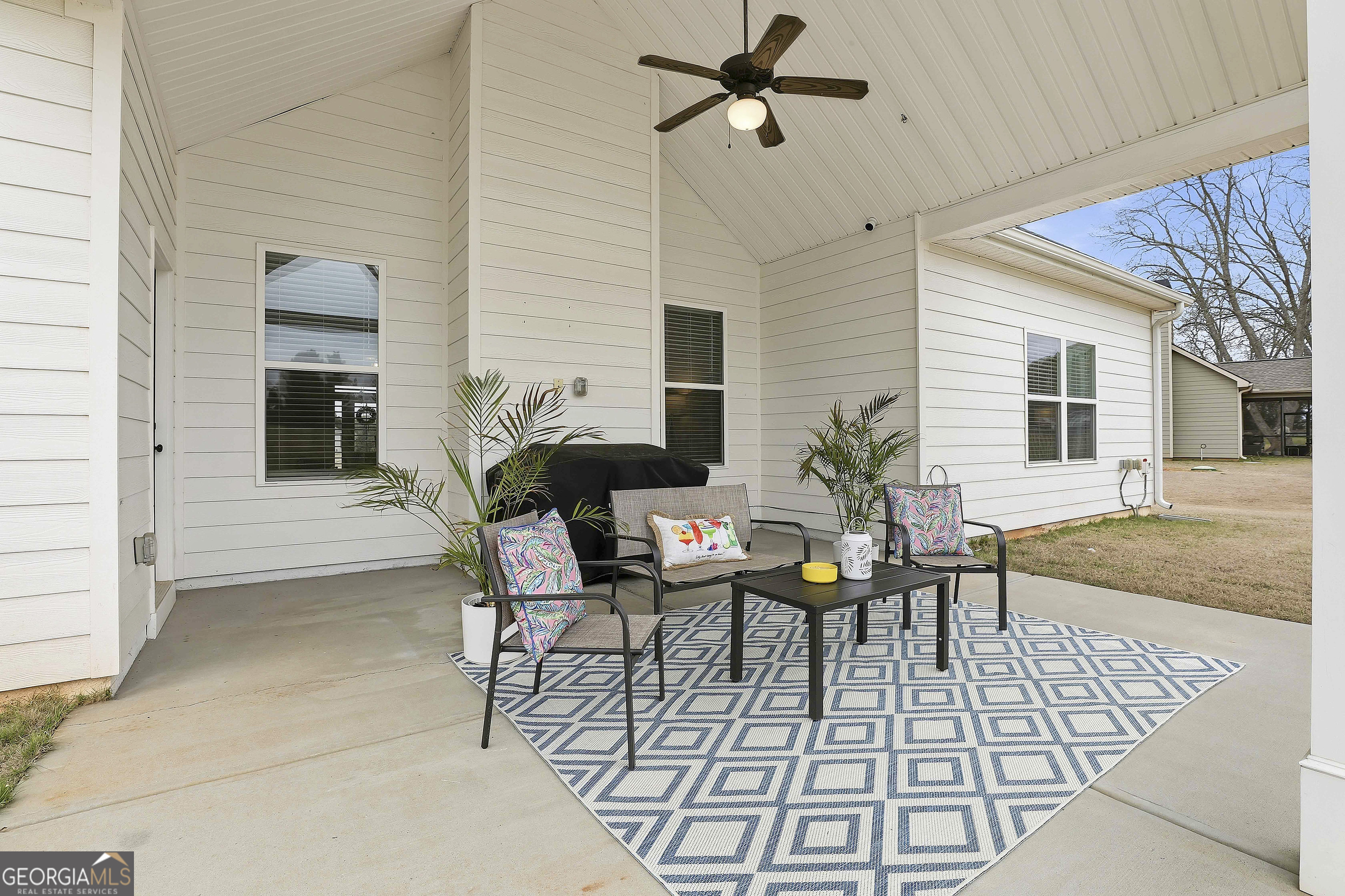 66 Chapman Farm Road Senoia, GA 30276 - Photo 38 of 46 a view of a dinning table and chair in the patio