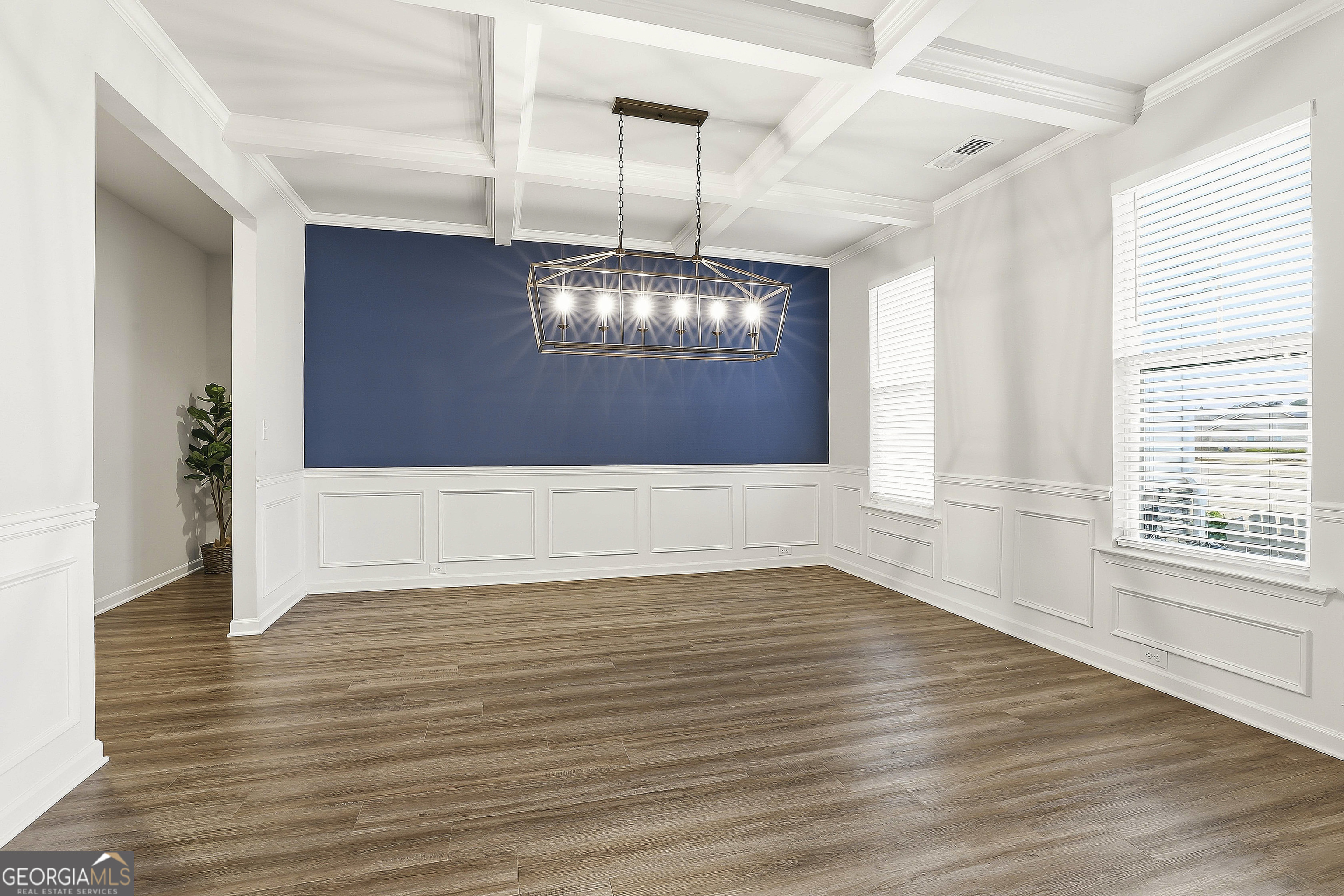 66 Chapman Farm Road Senoia, GA 30276 - Photo 7 of 46 a view of an empty room with wooden floor and a window