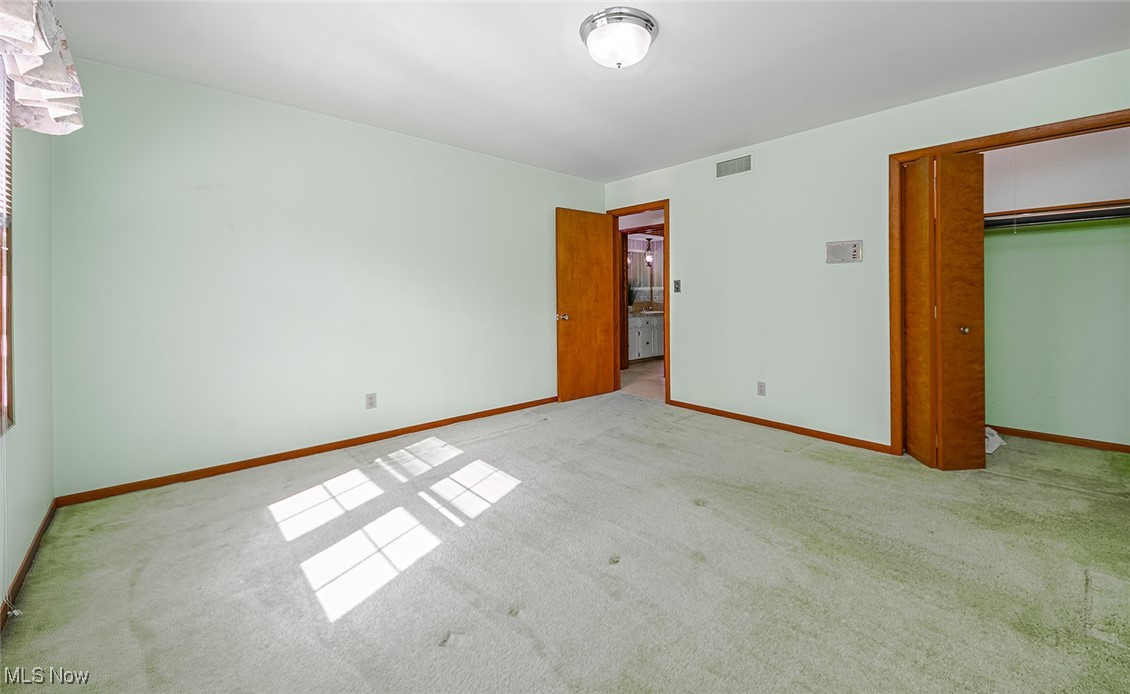3375 Bancroft Road Akron, OH 44333 - Photo 23 of 45 ery spacious bedroom with hardwood floors underneath carpet.