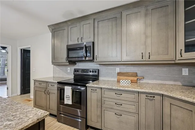 a view of a room with a ceiling fan