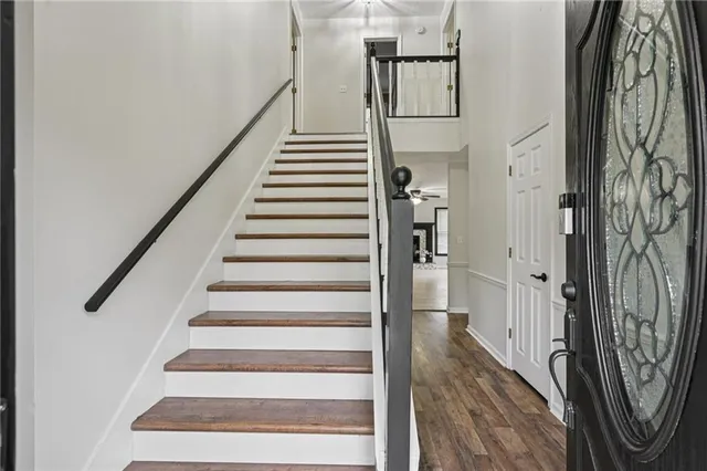 a kitchen with stainless steel appliances granite countertop a sink and a refrigerator