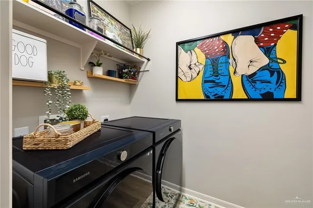 a spacious bedroom with a bed and a chandelier