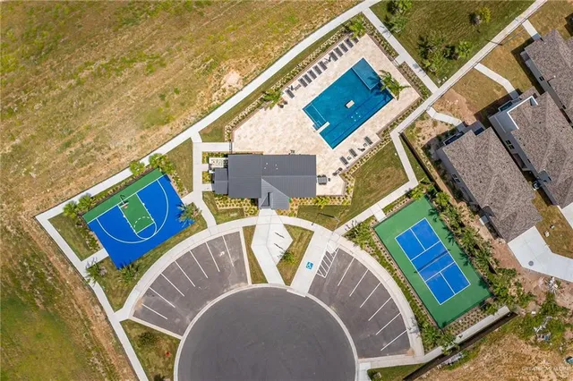 a view of a swimming pool with a lawn chairs