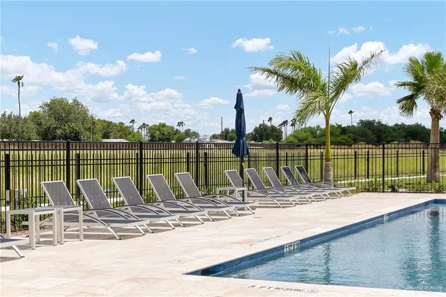 a view of a swimming pool with a lounge chairs