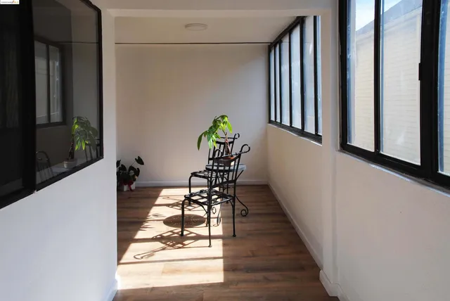 a view of entryway and hall with furniture