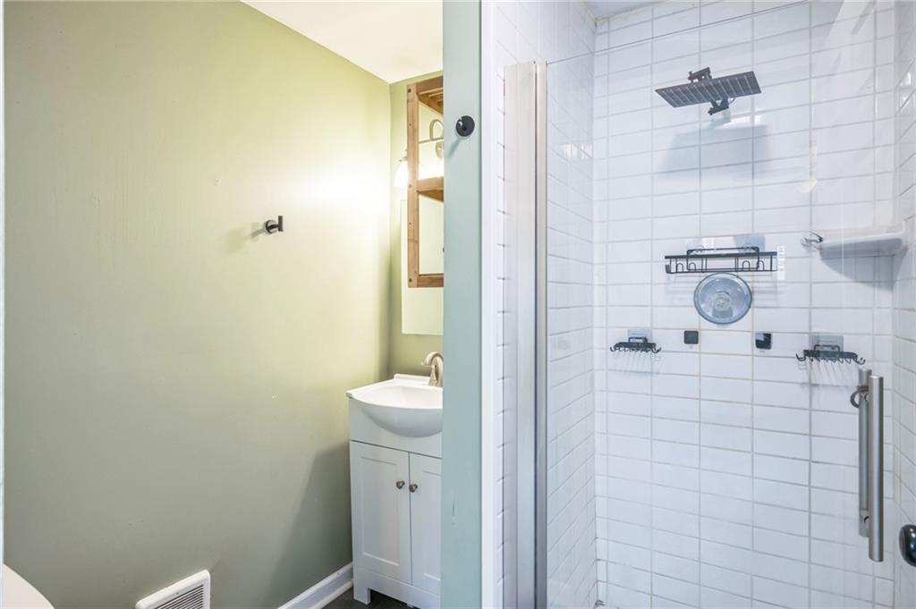 2318 Eccles Street Pittsburgh, PA 15210 - Photo 14 of 20 a bathroom with a sink a toilet and shower