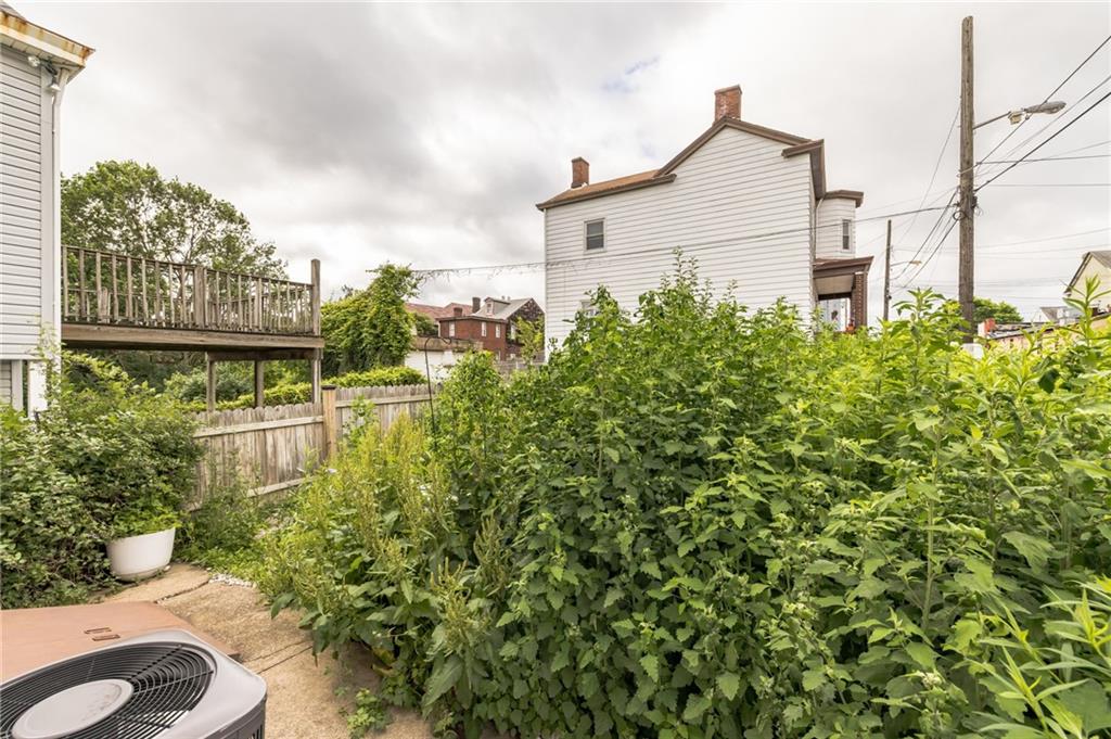 2318 Eccles Street Pittsburgh, PA 15210 - Photo 18 of 20 a aerial view of a house with a yard and potted plants