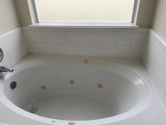 a view of a bathtub in a bathroom