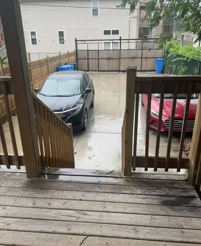 a view of a balcony with table and chairs