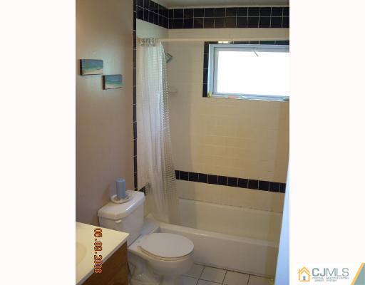 33 Finley Road Edison, NJ 08817 - Photo 8 of 10 a bathroom with a toilet and a shower