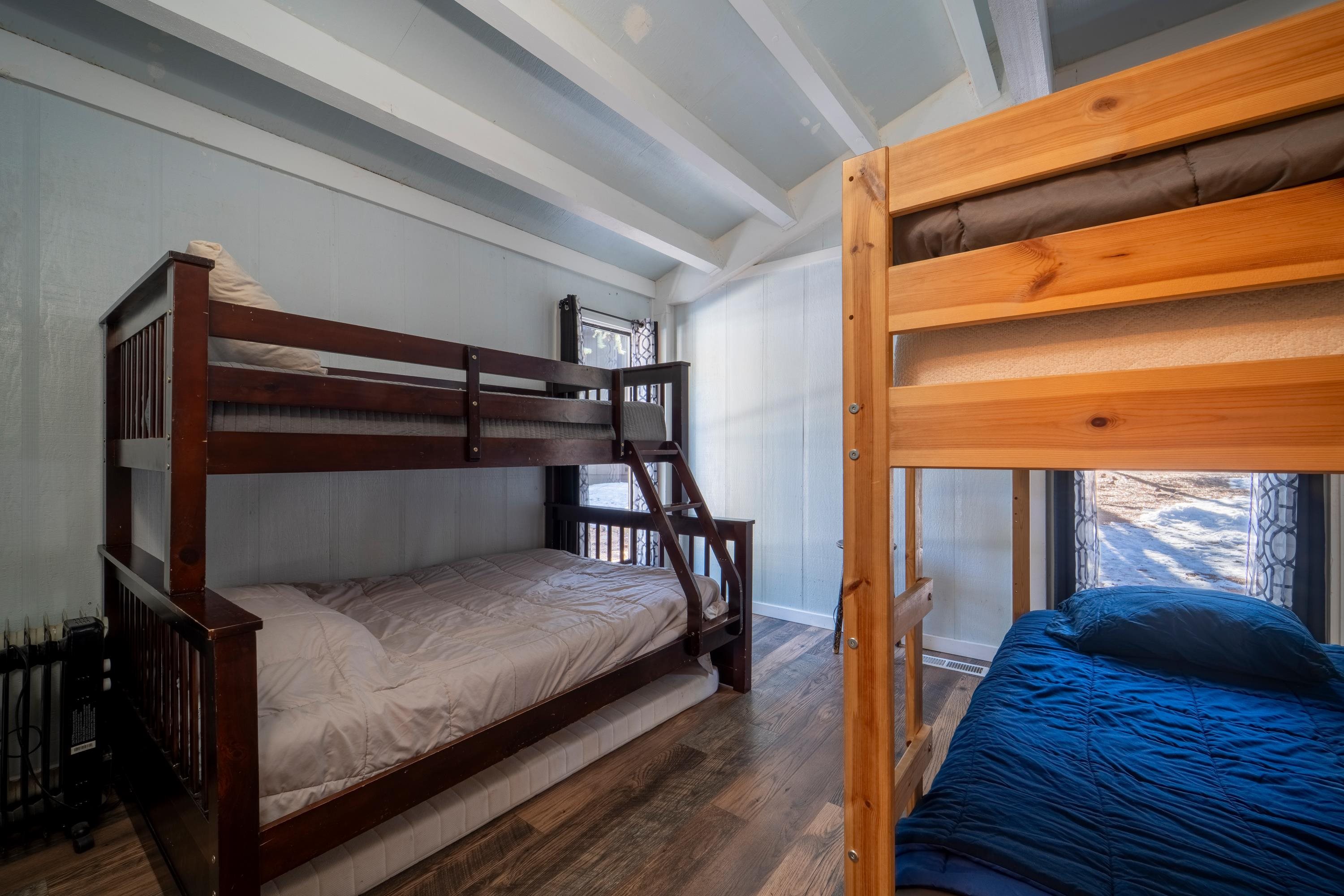 842 Beaver Pond Truckee, CA 96161 - Photo 12 of 22 a bedroom with a bed and wooden floor